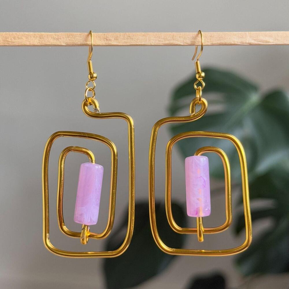 handmade gold wire spiral earrings with lilac purple colored tube beads